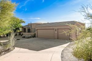 a house with a garage and a driveway at Serenity Peaks- Gorgeous Pet Friendly Villa in Scottsdale with Pool, Spa, and Bikes in Scottsdale +39 photos