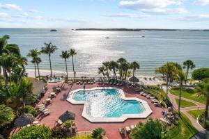 an aerial view of a swimming pool at the beach at Gorgeous Renovated Residence in Upscale Sanibel Harbour Tower in Fort Myers