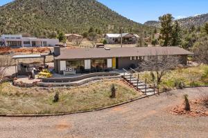 an aerial view of a house with a mountain at Mid-century Ranch Home in Sedona with Fantastic Red Rock Views in Sedona