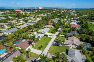 an aerial view of a residential neighborhood with houses and trees at Cute Coastal Home with Pool in Fort Myers
