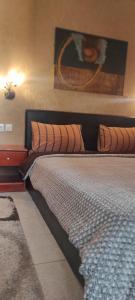 A bed or beds in a room at Erodios Guesthouse