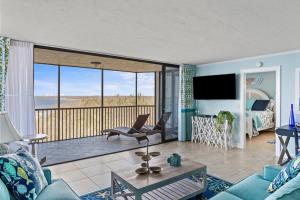a living room with a view of the ocean at Stunning Waterfront Residence with Panoramic Water Views in Fort Myers