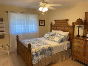 a bedroom with a bed and a ceiling fan at Gorgeous 3 Bedroom Home in the Dunes Sleeps 8 in Sanibel