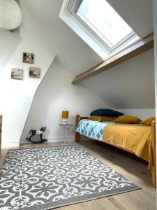 a bedroom with a bed and a window at Sara Home in Chennevières-sur-Marne