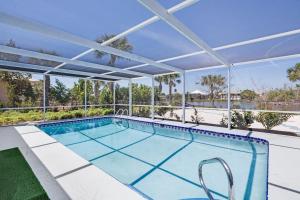 an image of a swimming pool in a house at Gorgeous Pool Home in Lake Murex Sanibel in Sanibel