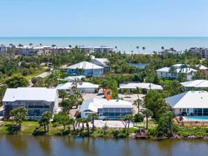 an aerial view of a resort with a body of water at Gorgeous Pool Home in Lake Murex Sanibel in Sanibel