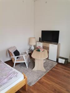 Televízia a/alebo spoločenská miestnosť v ubytovaní Malomszeg Apartman 3