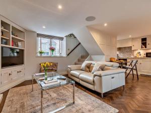 a living room with a couch and a table at 1 Bed in Alderwasley 94394 in Alderwasley