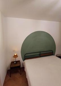 Cama o camas de una habitación en VictoriaeDomus (ostia antica)