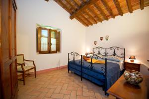 Ein Bett oder Betten in einem Zimmer der Unterkunft Agriturismo Palazzo Conti - B
