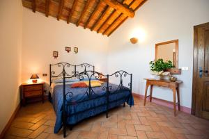 Posteľ alebo postele v izbe v ubytovaní Agriturismo Palazzo Conti - B