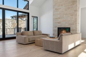 a living room with two couches and a fireplace at 1665 Cordillera Way in Edwards