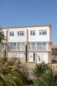an image of an apartment building with a balcony at Bright & modern Sussex seafront home Great views in Selsey