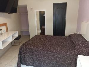 Postel nebo postele na pokoji v ubytování Hotel Imperial