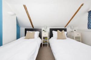 Ένα ή περισσότερα κρεβάτια σε δωμάτιο στο Charming three-bedroom central townhouse