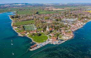 an aerial view of a small island in the water at Pretty Cottage Near City & Sea in Fishbourne