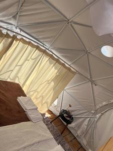 a room with a tent with a bed in it at Glamping ROSE (Luštica Bay) in Radovici