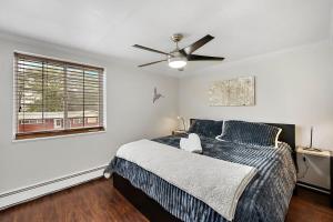 a bedroom with a bed and a ceiling fan at 1 1 Bright Corner Unit Walkability & Close to Hospitals in Englewood