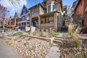 a house with a garden in front of it at Charming & Updated Garden Level in Heart of Denver in Denver