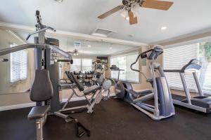 a gym with several treadmills and cardio machines at Furnished Natural Zen Jungle Studio by LAX w Desk in Los Angeles