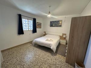 Postel nebo postele na pokoji v ubytování Casa Rural Matilde