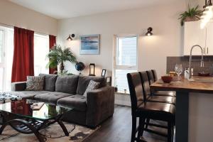 a living room with a couch and a table at NN - The Kit - Downtown 1-bed 1-bath in Whitehorse