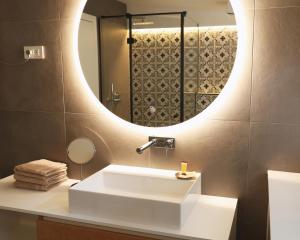 a bathroom with a white sink and a mirror at Villa Rodica, Bled in Bled +69 photos