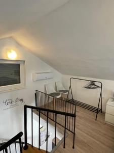 a living room with two chairs and a window at Villa Ana in Posedarje