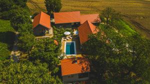 an overhead view of a house with orange roofs at Gardenguesthouse Mlinar in Fokovci