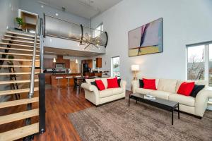 a living room with two couches and a table at NN - The Flame - Downtown 1-bed 2-bath in Whitehorse