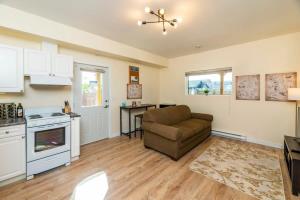 a living room with a couch and a kitchen at NN The Lavendar B Whistlebend 1bed 1bath in Whitehorse +10 photos