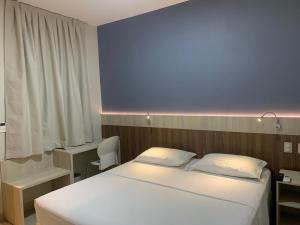 Postel nebo postele na pokoji v ubytování Hotel Gamboa Premium Macau