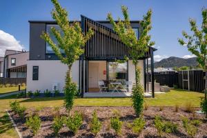 a modern home with trees in the yard at The 1 With The View in Albert Town