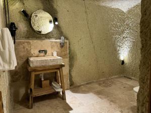 a bathroom with a sink and a mirror at Vie Cappadocia - Adults Only in Nevşehir
