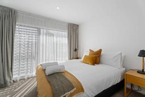 a bedroom with a large bed and a large window at Wilbro in Albert Town