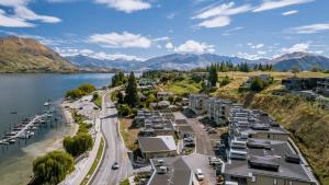 an aerial view of a town next to a lake at Luxuy Vista in Wanaka