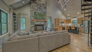 a living room with a couch and a fireplace at Holiday House in Blue Ridge