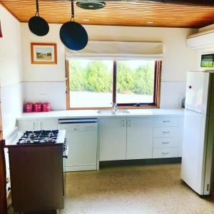 A kitchen or kitchenette at The Shack Gorgeous Getaway for 2 on Truffle Farm