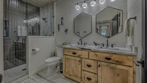 a bathroom with a sink and a toilet and a shower at Holiday House in Blue Ridge +29 photos