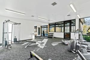 a gym with several exercise equipment in a room at Lakeview Luxury Vista 2-Bedroom in Wanaka