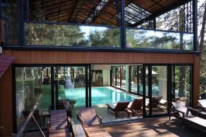 an external view of a house with a swimming pool at Hotel Borkovac in Ruma