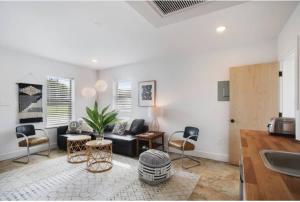 a living room with a couch and a table at River Breeze Quiet & Modern Black Pearl Apartment in New Orleans