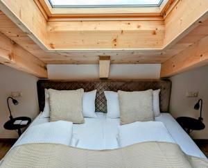 Postel nebo postele na pokoji v ubytování Staufen-Chalet Hochreit