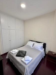 Postel nebo postele na pokoji v ubytování Harmony Central House