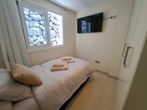 a bedroom with a bed with two towels on it at Azure Sky Villa - Panoramic ocean view, luxury, San Eugenio in Adeje +34 photos