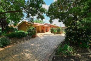 a brick driveway in front of a house at Aspen Abode - CBD, Fireplace, BBQ, 3 Smart TVs in Dubbo