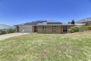 a house with solar panels on the roof at Serene Sullivan - Modern, Convenient, Pet Friendly in Orange