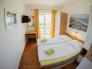 Кровать или кровати в номере Apartements Magdalena