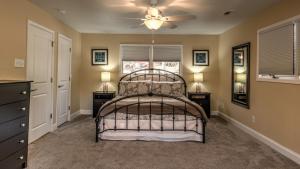 a bedroom with a bed and a ceiling fan at Jump Right In in Blue Ridge