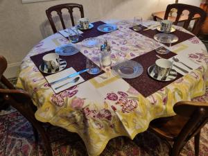 a table with a table cloth on top of it at Domaine de Belcayre in Montauban